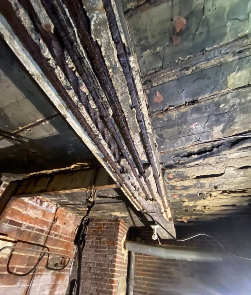 Epp Foundation Repair inspecting rotten wood support beams in a crawl space in Lincoln, NE.