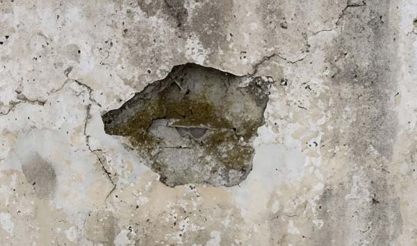 Concrete spalling is a condition involving the degradation of concrete surfaces. It's characterized by the disintegration of the surface layer of concrete, resulting in the formation of pits, flakes, and cracks.