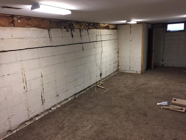 Cinder block repair might involve removing and replacing damaged blocks, installing steel I-beams or carbon fiber straps, and installing a drain tile system.