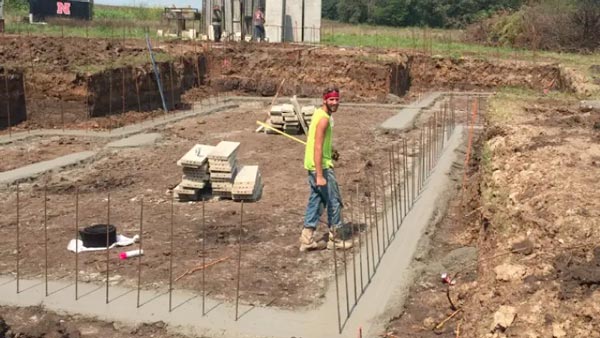 Concrete footings are structural elements that support the building's foundation. Footings distribute the building's weight uniformly to help prevent settlement.