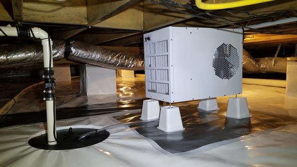 Crawl space encapsulation involves sealing up the entire space using a thick, vapor-retarding barrier that covers the crawl space's floor and walls.