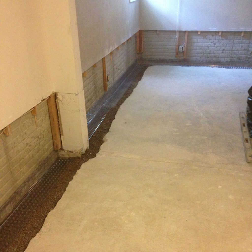 Photo of a basement drain tile installation to achieve ideal basement humidity